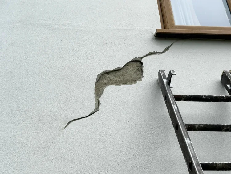 A hole in exterior render wall