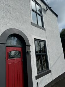 A house painted with Smokey White masonry paint