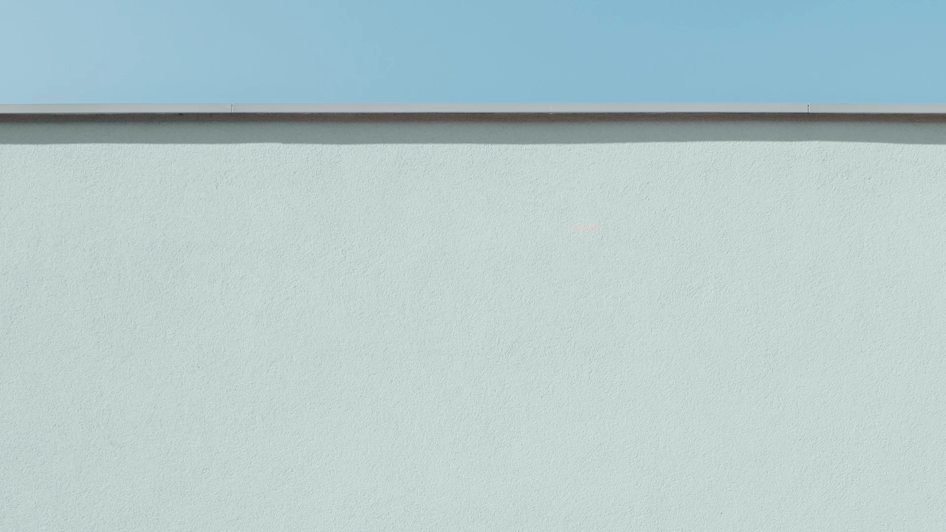 A wall house painted using Crystal Blue masonry paint