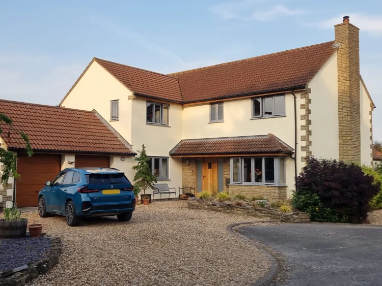 A modern rendered house painted with masonry paint