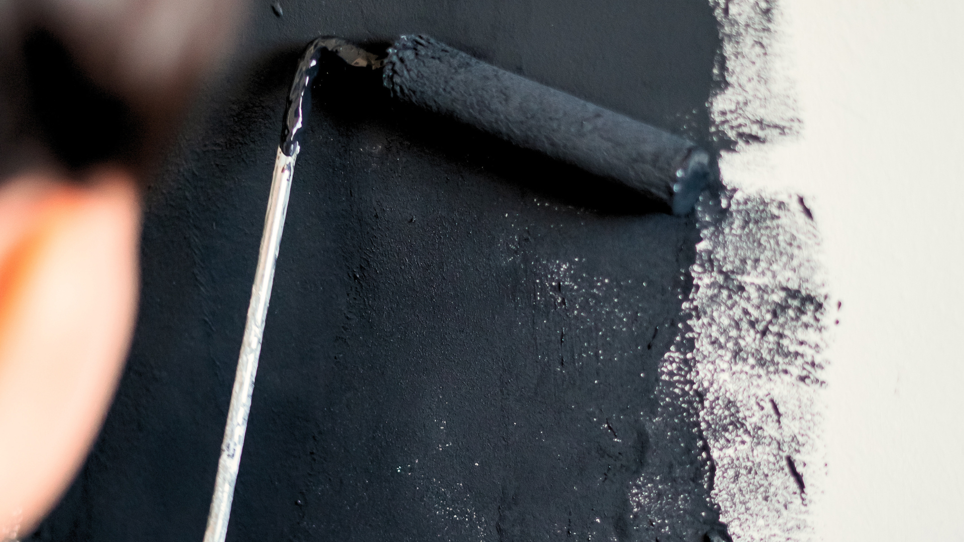 Applying dark masonry paint
