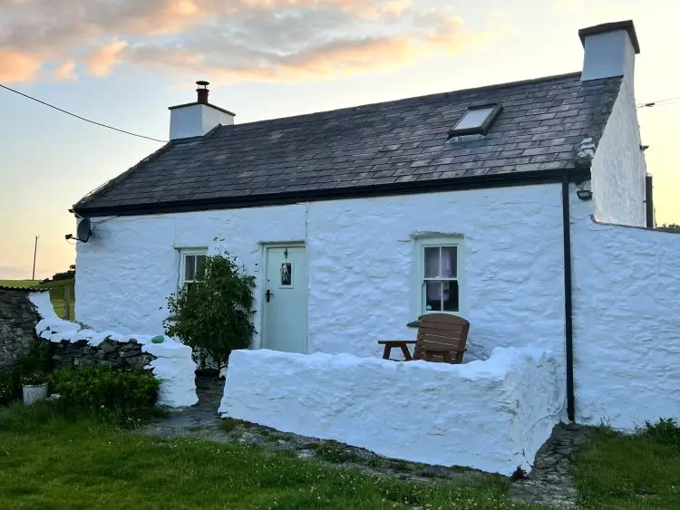 Bria's white cottage after painting it