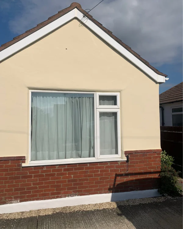 Bryan Dennett using Beige masonry paint