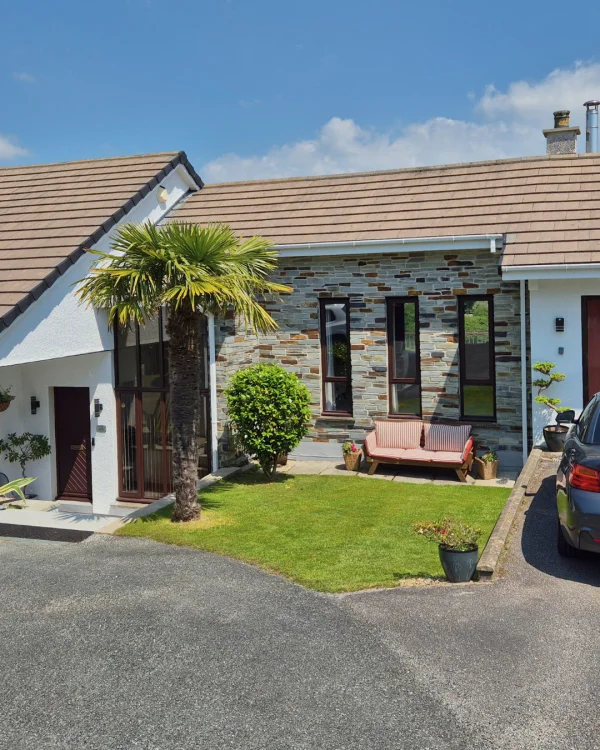 Clive Nicholas using Smokey White masonry paint