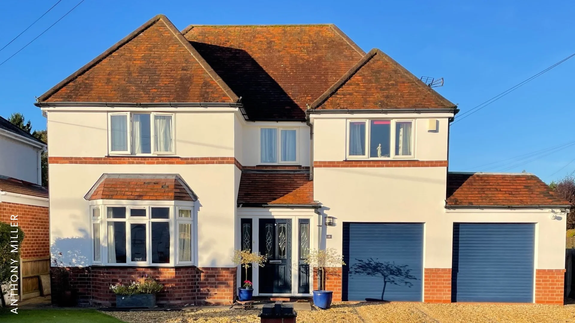 Emperor Masonry Paint in Off-White applied to house