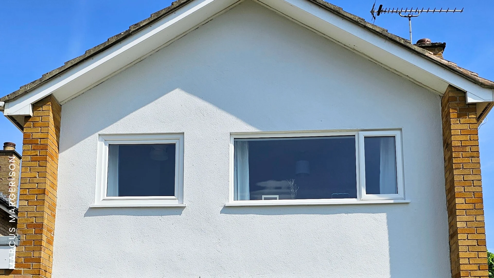 Emperor Masonry Paint in Smokey White applied to house