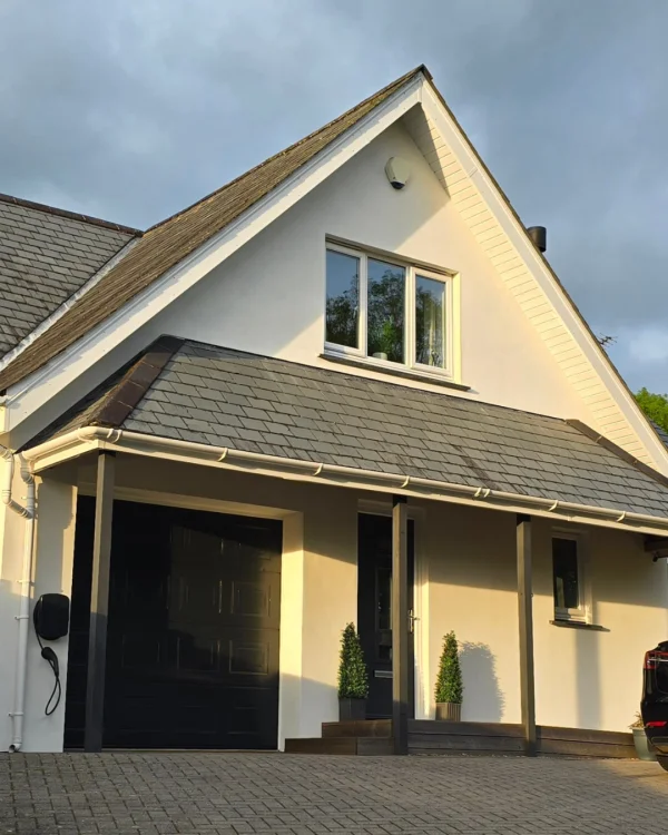 Jonathan using off-white masonry paint