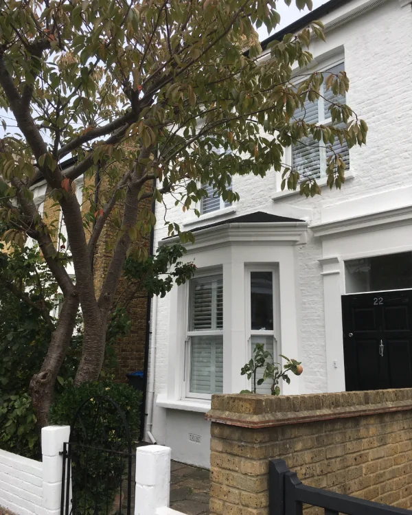 Masa's house painted with white masonry paint