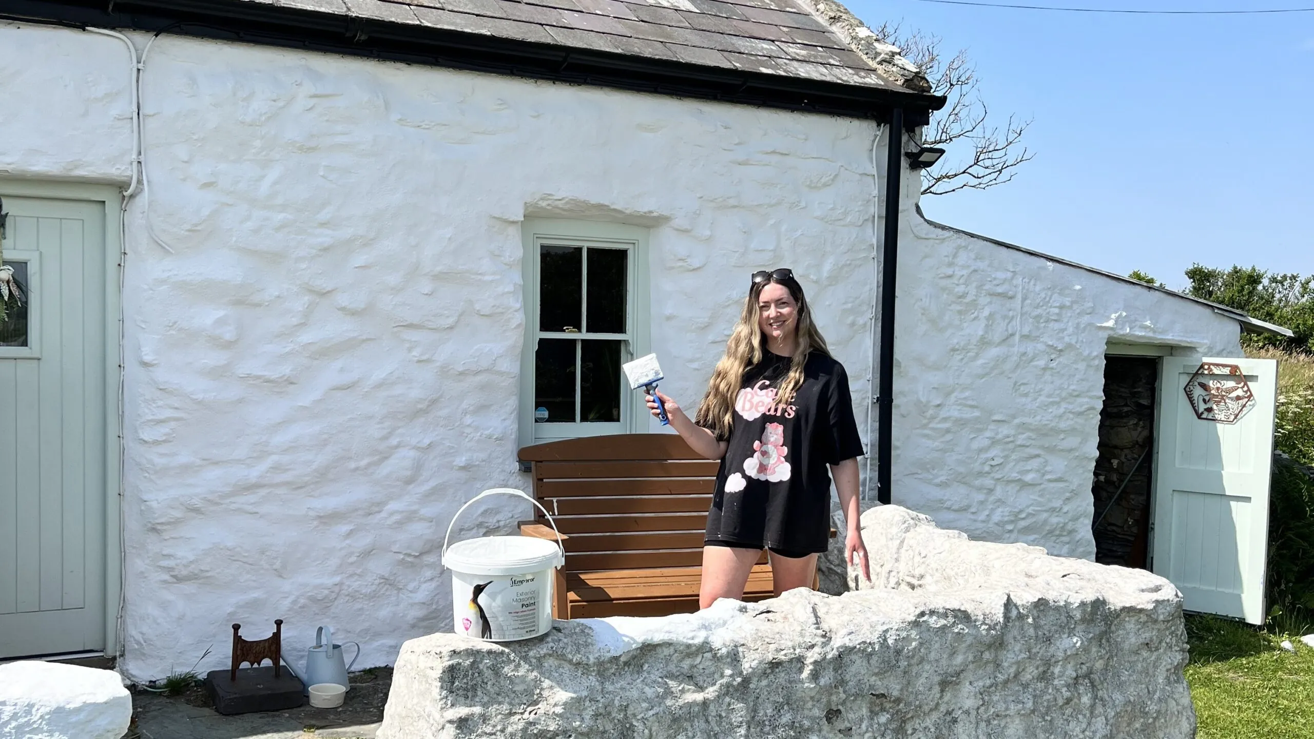 Painting the outside of a house white in the sun