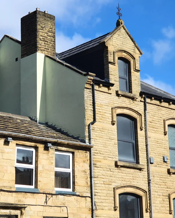 Paul Towlson using Green Mist masonry paint to paint the outside of their house