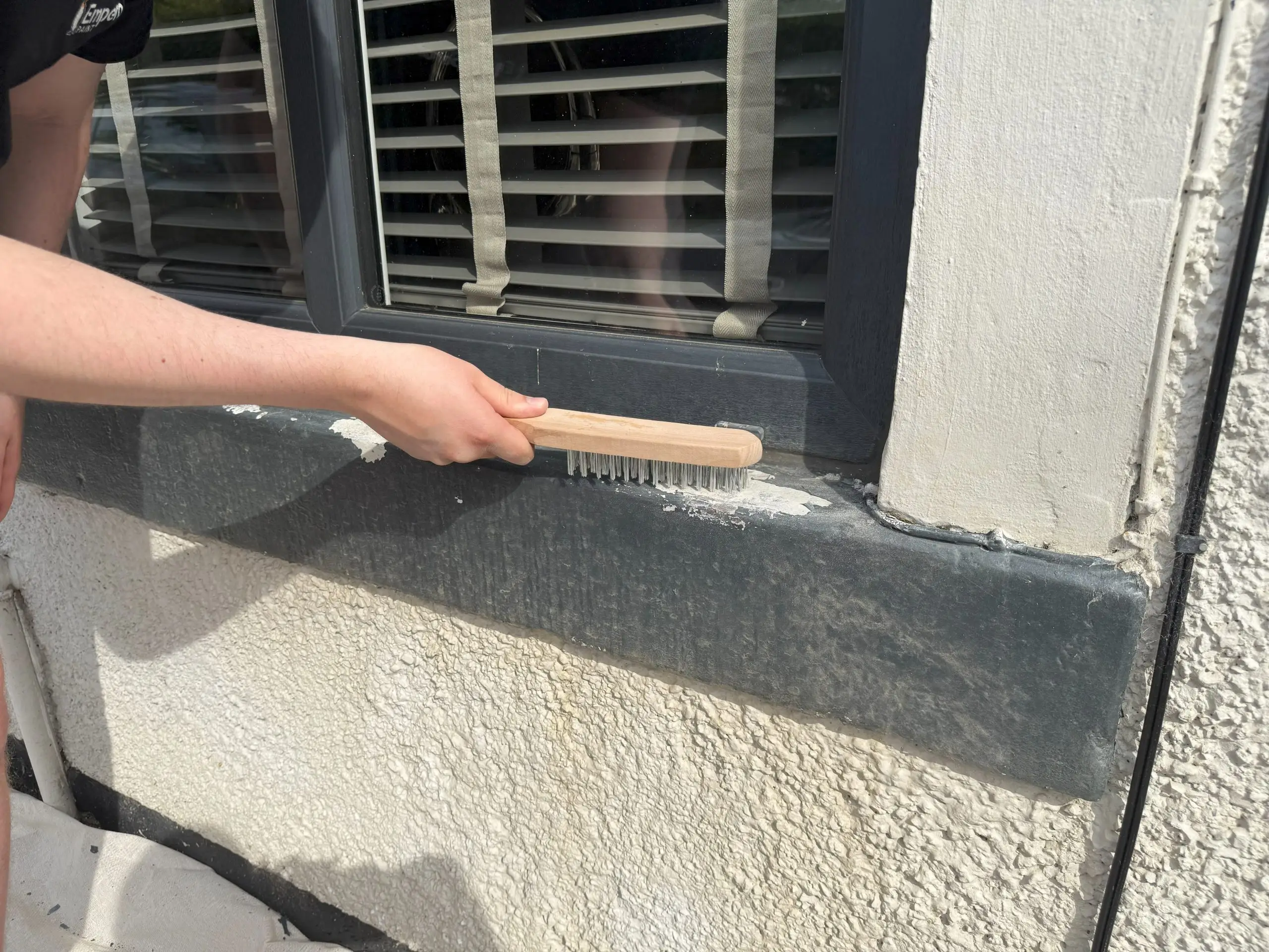 Removing flaking paint from window sill