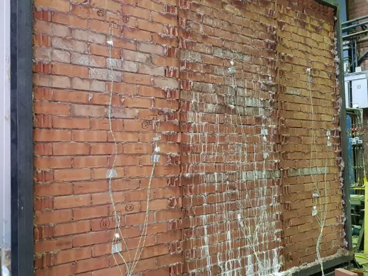 Salt efflorescence on brick wall