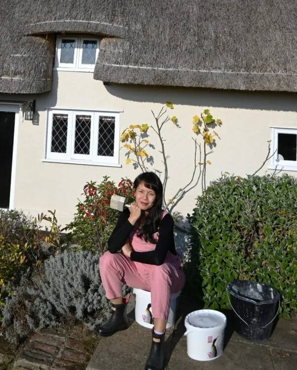 Susie after painting her house