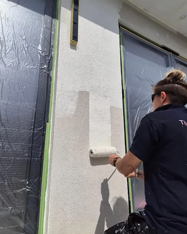 Trade customer painting a wall